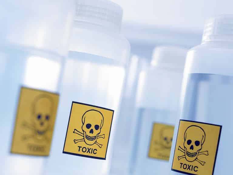 Several bottles with yellow "TOXIC" label